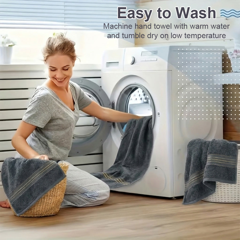 Dark gray cotton bath towel set, neatly folded towels on a laundry chair