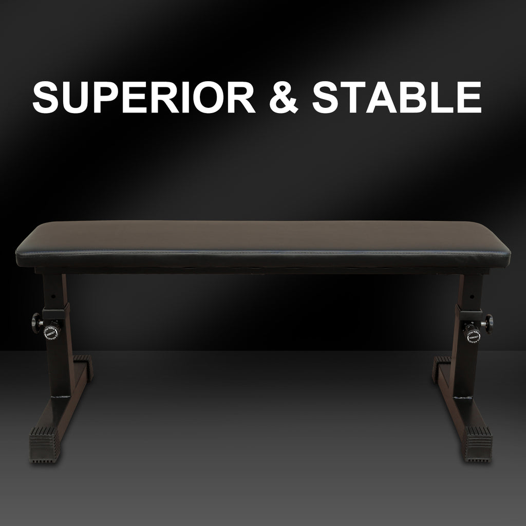 Flat weight bench with dark padded top and adjustable steel base, black frame.
