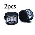 Pair of boxing hand wraps with Top KING logo, dark black wrist and knuckle bandages.