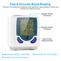White digital wrist blood pressure monitor with blue LCD showing SYS, DIA, and pulse icons.