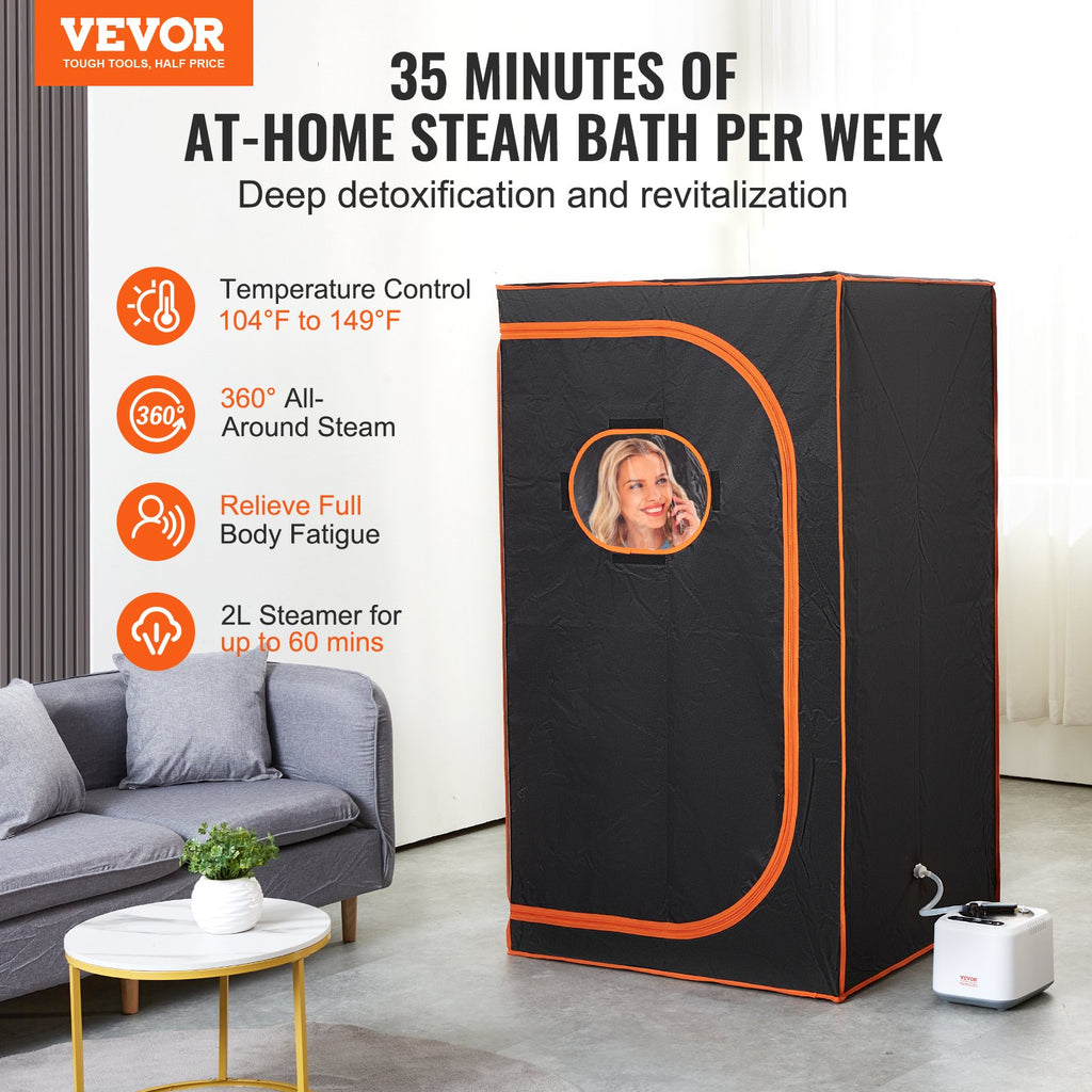 Full-size black steam sauna tent with orange trim and circular logo; steamer on floor