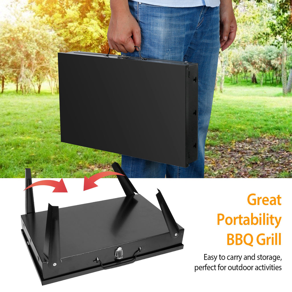 Black foldable BBQ grill being carried, compact base with latch and folding frame