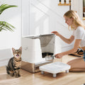 XL stainless steel litter box with flip-top open for access, side entry step and scoop; tabby cat nearby