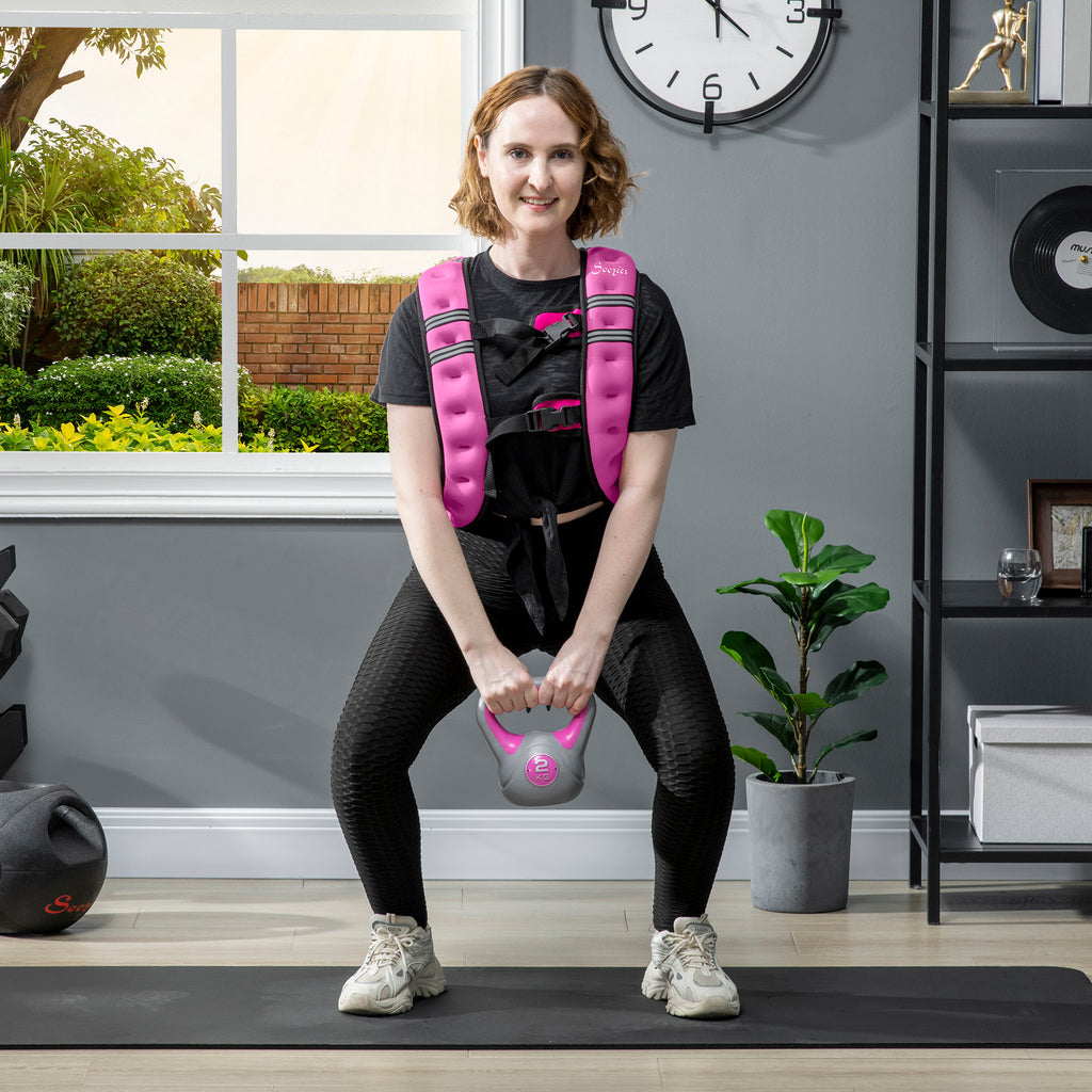 Woman wearing pink weighted training vest with black adjustable straps and front weight panel