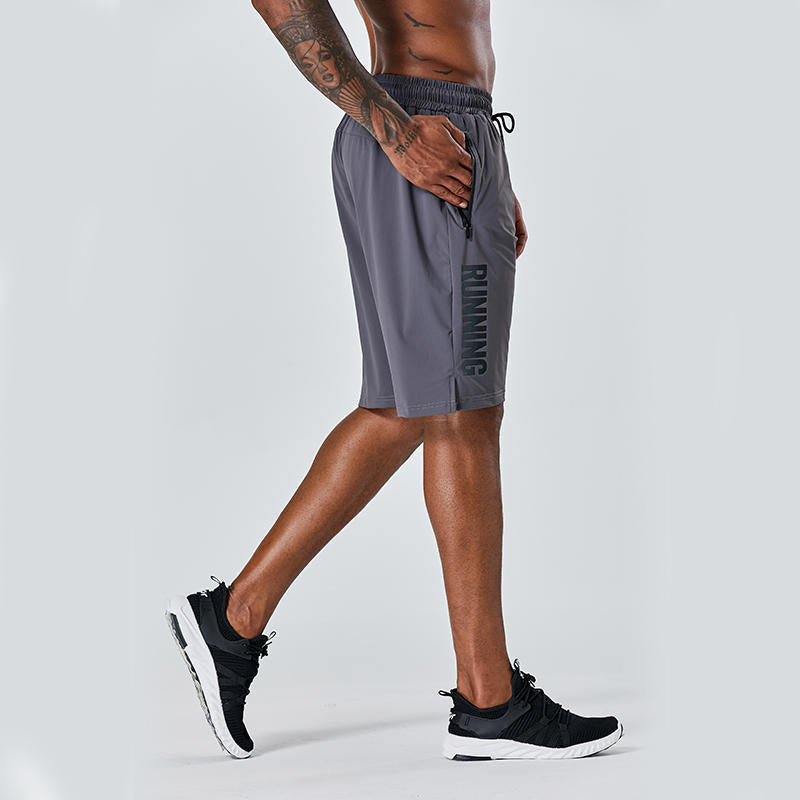 Light gray quick-dry running shorts with drawstring waist and side logo stripe.