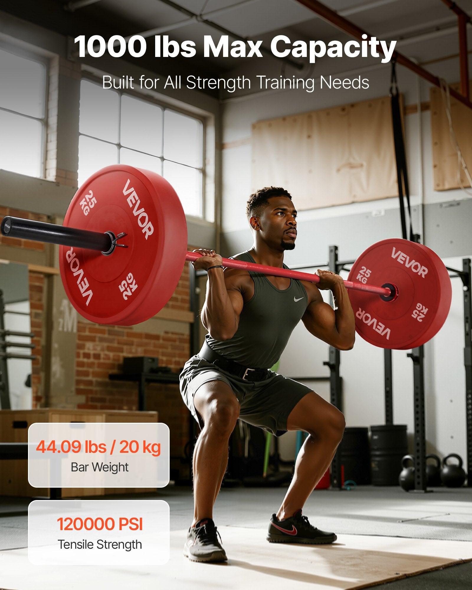 Olympic barbell with red shaft and black end sleeves with round weight plates mounted