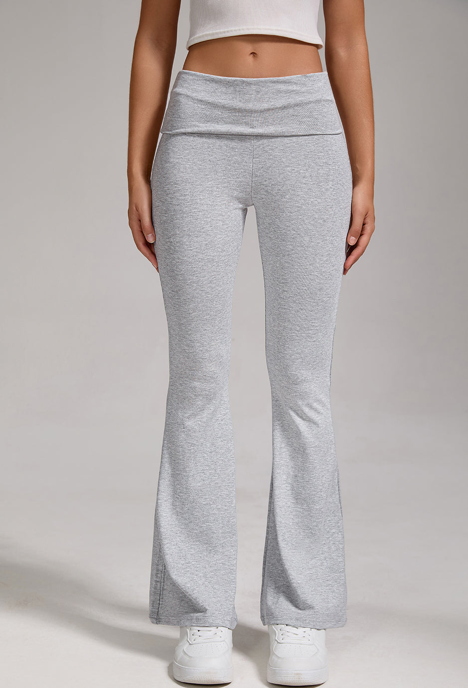 Heather grey yoga flares with fold-over high waist and wide bell hem, straight-on view