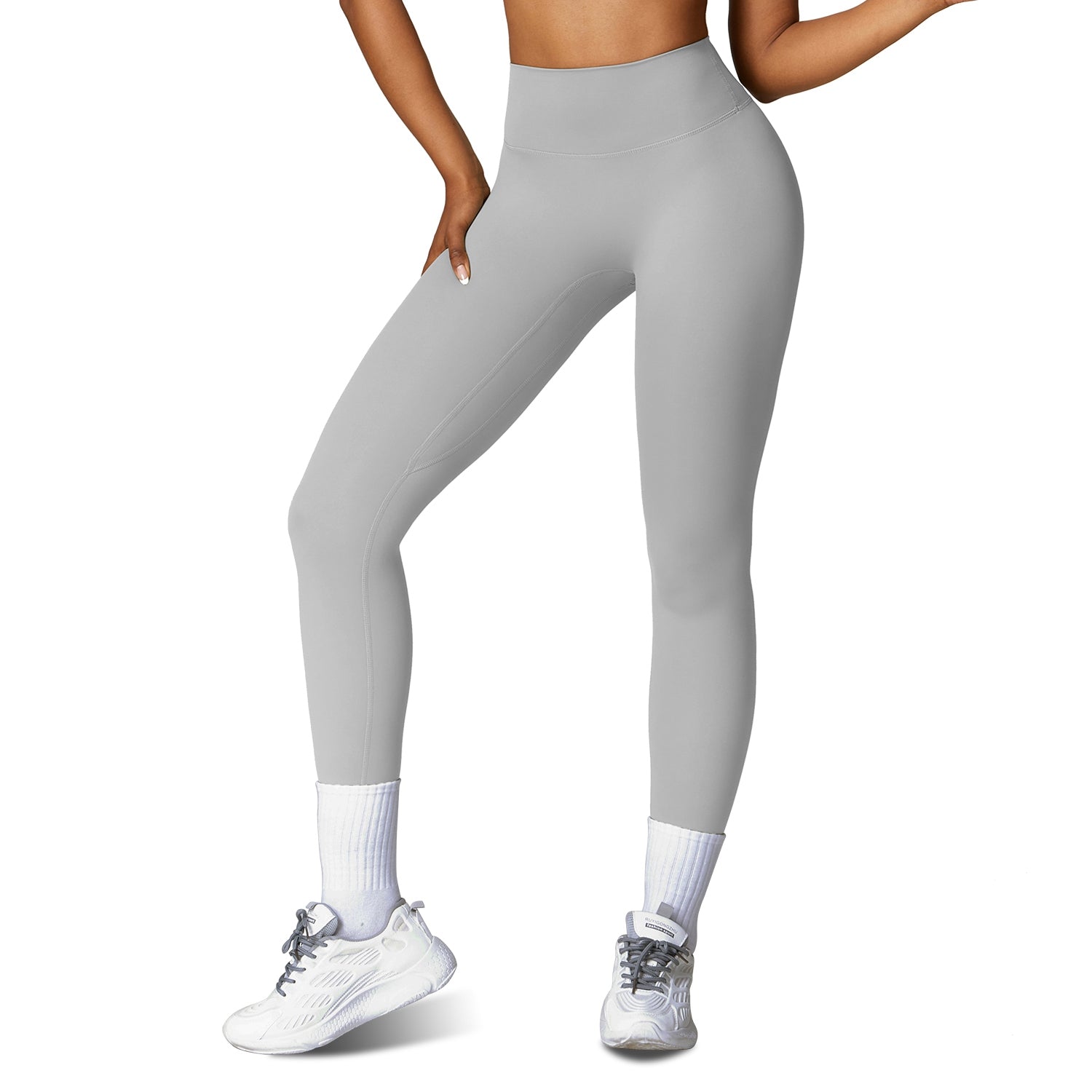 High-waist workout leggings in light grey, smooth compression fabric with ankle length