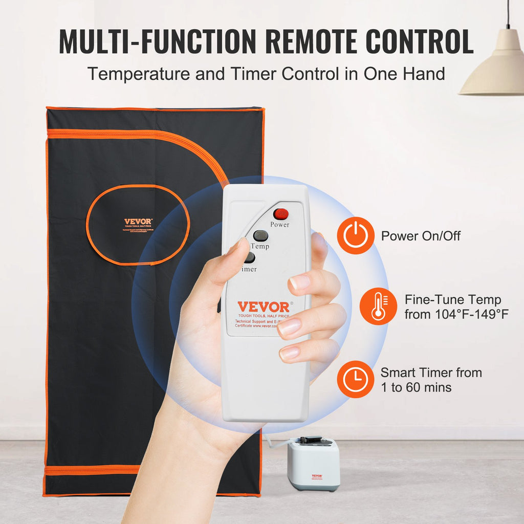 Black steam sauna tent with orange trim and remote controller for temperature and timer