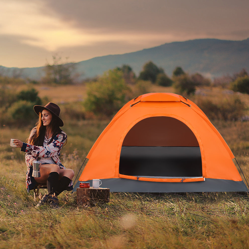 Orange 1-person dome tent with front door opening and dark gray floor panel